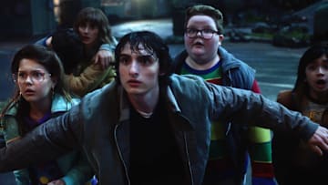 Winona Ryder as Joyce Byers, Finn Wolfhard as Mike Wheeler, and Jake Connelly as Derek in Stranger Things season 5