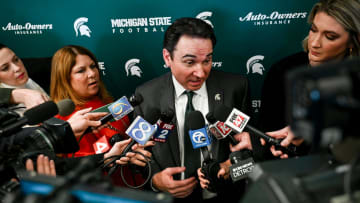 Michigan State football coach Jonathan Smith talks with reporters during an introductory press
