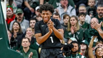 Michigan State's Jeremy Fears Jr. celebrates after drawing a Stony Brook charge during the first half on Thursday, Dec. 21, 2023, at the Breslin Center in East Lansing.