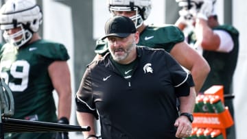 Michigan State's offensive line coach Chris Kapilovic works with players during the opening day of fall camp on Thursday, Aug. 5, 2021, on the MSU campus in East Lansing.

210805 Msu Fball Camp 007a