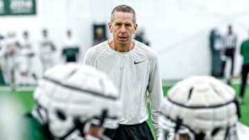 Michigan State's offensive coordinator Jay Johnson works with player during practice on Tuesday, March 29, 2022, at the indoor football facility in East Lansing.

220329 Msu Fb Practice 043a