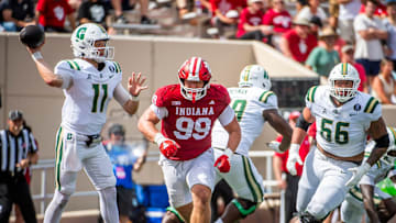 Indiana's James Carpenter (99) pressures Charlotte's Trexler Ivey (11) during the Indiana versus Charlotte football game at Memorial Stadium on Saturday, Sept. 21, 2024.