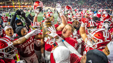 Indiana's Mike Katic (56) and the Hoosiers hoist the Old Oaken Bucket after the Indiana versus Purdue football game at Memorial Stadium on Saturday, Nov. 30, 2024.