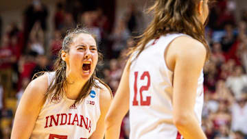 Indiana's Mackenzie Holmes (54) celebrates with Yarden Garzon (12) during the fourth quarter during second round NCAA action at Simon Skjodt Assembly Hall on Saturday, March 23, 2204.