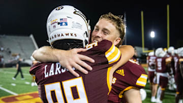 ULM Warhawks' Max Larson (99) and Makenzie Ryan (47) celebrate winning the game against the Jackson State Tigers in Monroe, La., on Thursday, Aug. 29, 2024.