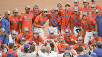 Jun 9, 2024; Clemson, SC, USA; The Florida Gators pose for a photo after their win against Clemson in the NCAA baseball Clemson Super Regional at Doug Kingsmore Stadium. Mandatory Credit: Ken Ruinard - USA TODAY Sports