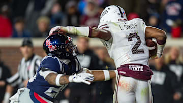 Mississippi State's safety Isaac Smith (2) runs the ball after intercepting it during the Egg Bowl game against at Vaught-Hemingway Stadium on Friday, Nov. 29, 2024.