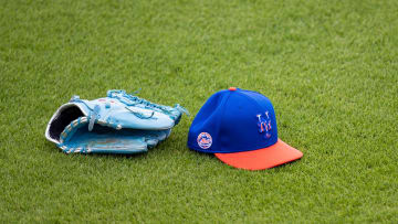 Feb 22, 2021; Port St. Lucie, Florida, USA; The hat and glove of New York Mets starting pitcher