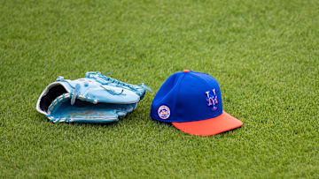 Feb 22, 2021; Port St. Lucie, Florida, USA; The hat and glove of New York Mets starting pitcher