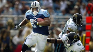 Running back Eddie George (27), in action against Jacksonville Jaguars in Jacksonville, Fla., on Oct. 26, was the Tennessee Titans' leading rusher for 2003 with 1,031 yards on 312 carries with 5 rushing touchdowns.