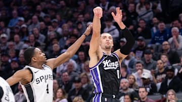 Mar 7, 2025; Sacramento, California, USA; Sacramento Kings guard Zach LaVine (8) takes a three point shot over San Antonio Spurs guard De'Aaron Fox (4) during the second quarter at Golden 1 Center. Mandatory Credit: Ed Szczepanski-Imagn Images