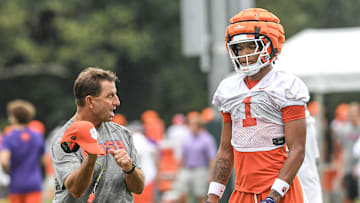 Clemson head coach Dabo Swinney talks with Clemson wide receiver T.J. Moore (1) during the Clemson first football August practice in Clemson, S.C. Thursday August 1, 2024.