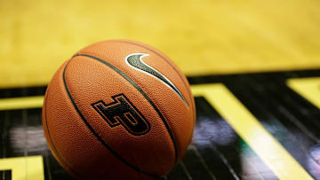 A Nike Basketball with a Purdue logo sits on the court of Mackey Arena