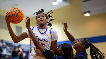 Canton Tigers' center Shamira Morton (25) catches the ball during the game against the Cleveland Central Wolves in Canton, Miss., on Tuesday, Jan. 28, 2025.