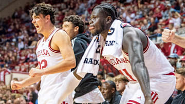 Indiana's Oumar Ballo (11) and Trey Galloway (32) celebrate a dunk during the the Indiana versus Marian men's basketball game