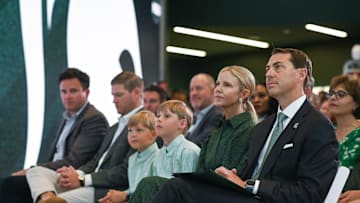 Michigan State Univeristy Athletic Director J Batt, right, listens to MSU basketball coach Tom Izzo, Wednesday, June 4, 2025, before being introduced to the Spartan community as the new athletic director. Seated next to Batt is wife Leah, and sons Fitzgerald and Graham.