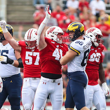 University of Wisconsin Badgers football players celebrate a 4th down stop against Michigan during their game Saturday, October 2, 2021 in Madison, Wis. Michigan won the game 38-17. 