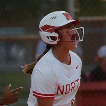 North Fort Myers player Abigail Hynes yells in excitement after a big hit by a teammate. The North Fort Myers High School varsity softball team dominated Fort Myers and went on to win the District 5A-11 championship game Thursday, May 4, 2023, with a final score of 11-1.