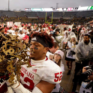 Indiana players celebrate after defeating Purdue 44-41 in double overtime to win the Old Oaken Bucket in 2019.
