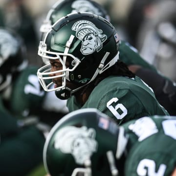 Michigan State's Maliq Carr and the Spartans sport the gruff Sparty helmet for the game against Indiana on Saturday, Nov. 19, 2022, at Spartan Stadium in East Lansing.

221119 Msu Indiana 020a