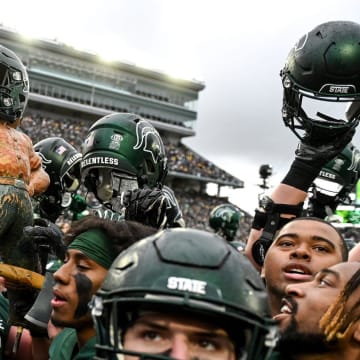 Michigan State celebrates with the Paul Bunyan Trophy after beating Michigan on Saturday, Oct. 30, 2021, at Spartan Stadium in East Lansing.

211030 Msu Michigan 257a