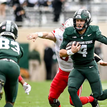 Michigan State's Sam Leavitt runs for a first down against Nebraska during the fourth quarter on Saturday, Nov. 4, 2023, at Spartan Stadium in East Lansing.