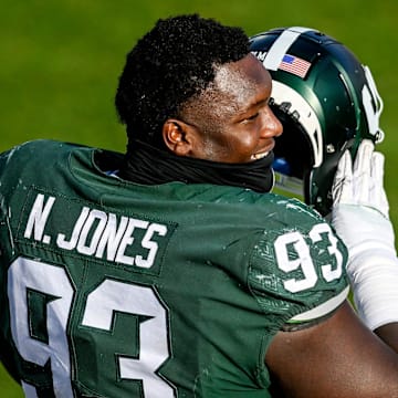 Michigan State's Naquan Jones talks with teammates on the sideline during the third quarter in the game against Indiana on Saturday, Nov. 14, 2020, at Spartan Stadium in East Lansing.

201114 Msu Indiana 162a