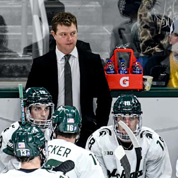 Michigan State's head coach Adam Nightingale, center, looks on during the third period in the game against Michigan on Friday, Dec. 9, 2022, at Munn Arena in East Lansing.

221209 Msu Mich Hockey 125a