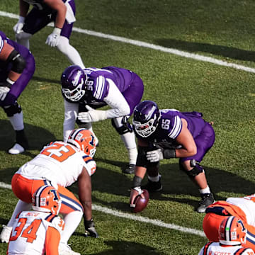 The Northwestern Wildcats prepare to snap the ball against the Illinois Fighting Illini at Wrigley Field on November 30, 2024.