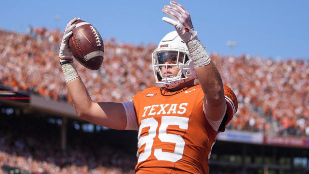 Texas Longhorns tight end Gunnar Helm celebrates a touchdown during a college football game.