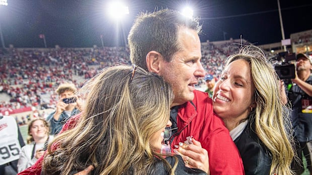 Indiana Head Coach Curt Cignetti gets a hug from his children after the Indiana versus Michigan football game at Memorial Sta