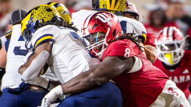 Indiana's CJ West tackles Michigan's Donovan Edwards.