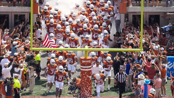 Texas Longhorns take the field against the Rice Owls in the first half of an NCAA college football
