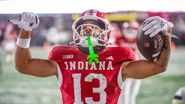 Indiana's Elijah Sarratt (13) celebrates a touchdown during the Indiana versus Purdue football game at Memorial Stadium on Saturday, Nov. 30, 2024.