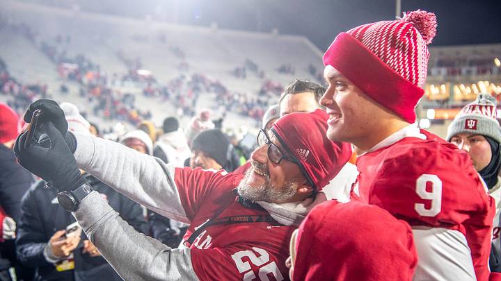 Indiana's Kurtis Rourke (9) poses witha fan after the Indiana versus Purdue football game at Memorial Stadium on Saturday, Nov. 30, 2024.