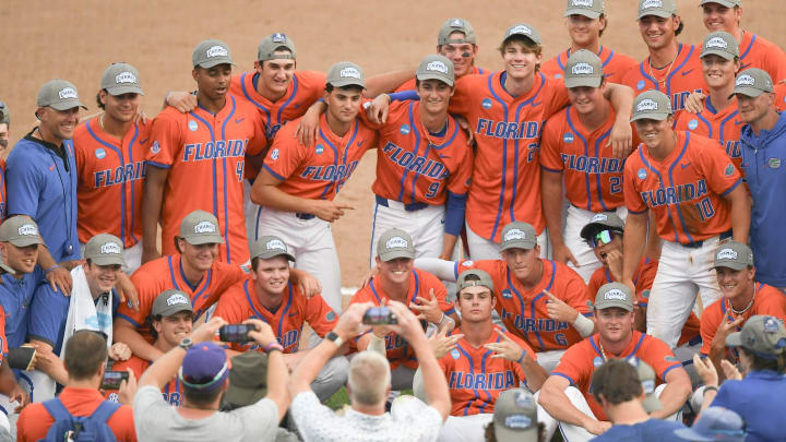 Jun 9, 2024; Clemson, SC, USA; The Florida Gators pose for a photo after their win against Clemson in the NCAA baseball Clemson Super Regional at Doug Kingsmore Stadium. Mandatory Credit: Ken Ruinard - USA TODAY Sports