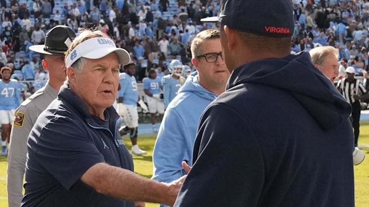 Oct 25, 2025; Chapel Hill, North Carolina, USA; North Carolina Tar Heels head coach Bill Belichick shakes Virginia Cavaliers head coach Tony Elliott hand after the Tar Heels lose to Virginia in overtime at Kenan Stadium. Mandatory Credit: Bob Donnan-Imagn Images