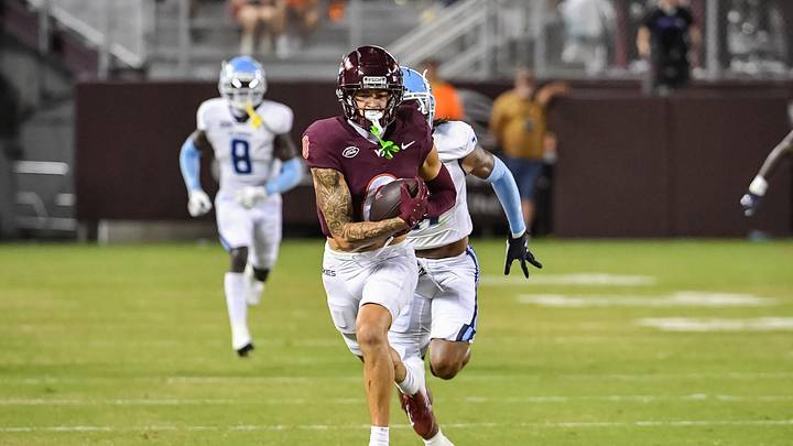 Sep 13, 2025; Blacksburg, Virginia, USA;  Virginia Tech Hokies wide receiver Ayden Greene (0) runs after a catch during the third quarter at Lane Stadium. Mandatory Credit: Brian Bishop-Imagn Images