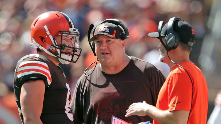 Cleveland Browns quarterback Baker Mayfield meets with offensive coordinator Alex Van Pelt, center, and head coach Kevin Stefanski during the first half against the Houston Texans, Sunday, Sept. 19, 2021, in Cleveland.