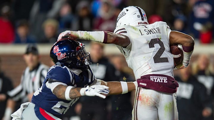 Mississippi State's safety Isaac Smith (2) runs the ball after intercepting it during the Egg Bowl game against at Vaught-Hemingway Stadium on Friday, Nov. 29, 2024.
