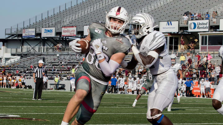 University of Louisiana at Monroe's Josh Pederson (86) makes a catch and carries the ball.