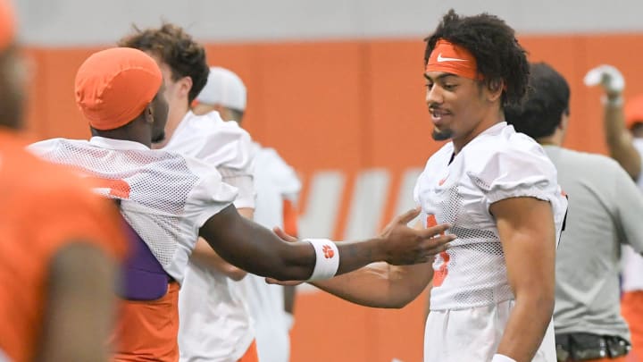 Clemson receiver Tyler Brown (6) and wide receiver Antonio Williams(0) share a smile during the Clemson first football August practice in Clemson, S.C. Thursday August 1, 2024.