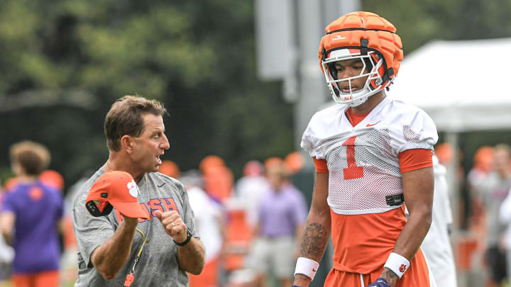 Clemson head coach Dabo Swinney talks with Clemson wide receiver T.J. Moore (1) during the Clemson first football August practice in Clemson, S.C. Thursday August 1, 2024.