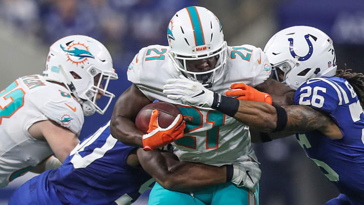 Indianapolis Colts middle linebacker Anthony Walker (50) and strong safety Clayton Geathers (26) surround Miami Dolphins running back Frank Gore (21) during the first half of the game at Lucas Oil Stadium in Indianapolis, Sunday, Nov. 25, 2018. The Colts won, 27-24.