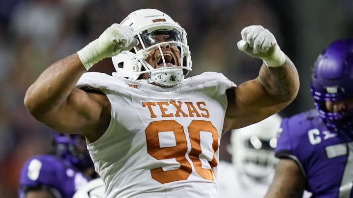 Texas Longhorns defensive lineman Byron Murphy II (90) celebrates after a sack against TCU Horned Frogs quarterback Josh Hoover (10) in the second quarter of an NCAA college football game, Saturday, November. 11, 2023, at Amon G. Carter Stadium in Fort Worth, Texas.