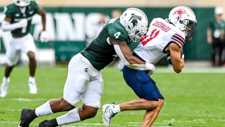 Michigan State's Jacoby Windmon tackles Richmond's Nick DeGennaro during the second quarter on Saturday, Sept. 9, 2023, at Spartan Stadium in East Lansing.