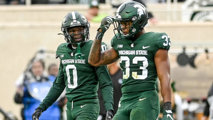 Michigan State's Charles Brantley, left, and Kendell Brooks, right, walk back to the sideline after Minnesota's Nick Kallerup's touchdown during the third quarter on Saturday, Sept. 24, 2022, at Spartan Stadium in East Lansing.

220924 Msu Minn Fb 136a