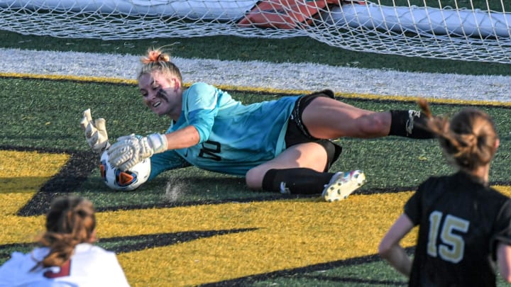 TL Hanna junior Henley Grunst saves a ball by Wando High sophomore Kylie Cino during overtime in the Class AAAAA 2022 SCHSL girl  s Soccer State Championship game at Irmo High School Saturday, May 14, 2022.

Class Aaaaa 2022 Schsl Girl S Soccer State Championship