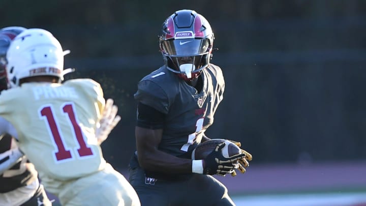 Westside High receiver Chamarryus Bomar (1) runs near Creekside High School junior Eric Paul Jr (11) during the first quarter at Westside High in Anderson, S.C. Saturday, August 24, 2024.