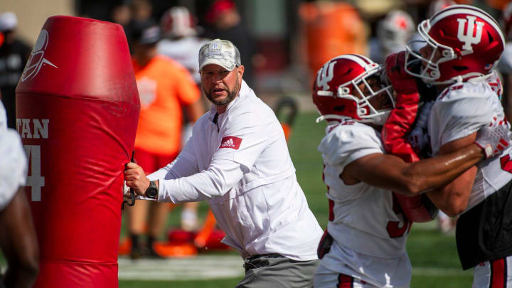 Indiana University Defensive Coordinator Bryant Haines instructs players during fall practice at the Mellencamp Pavilion at Indiana University on Friday, Aug. 16, 2024.